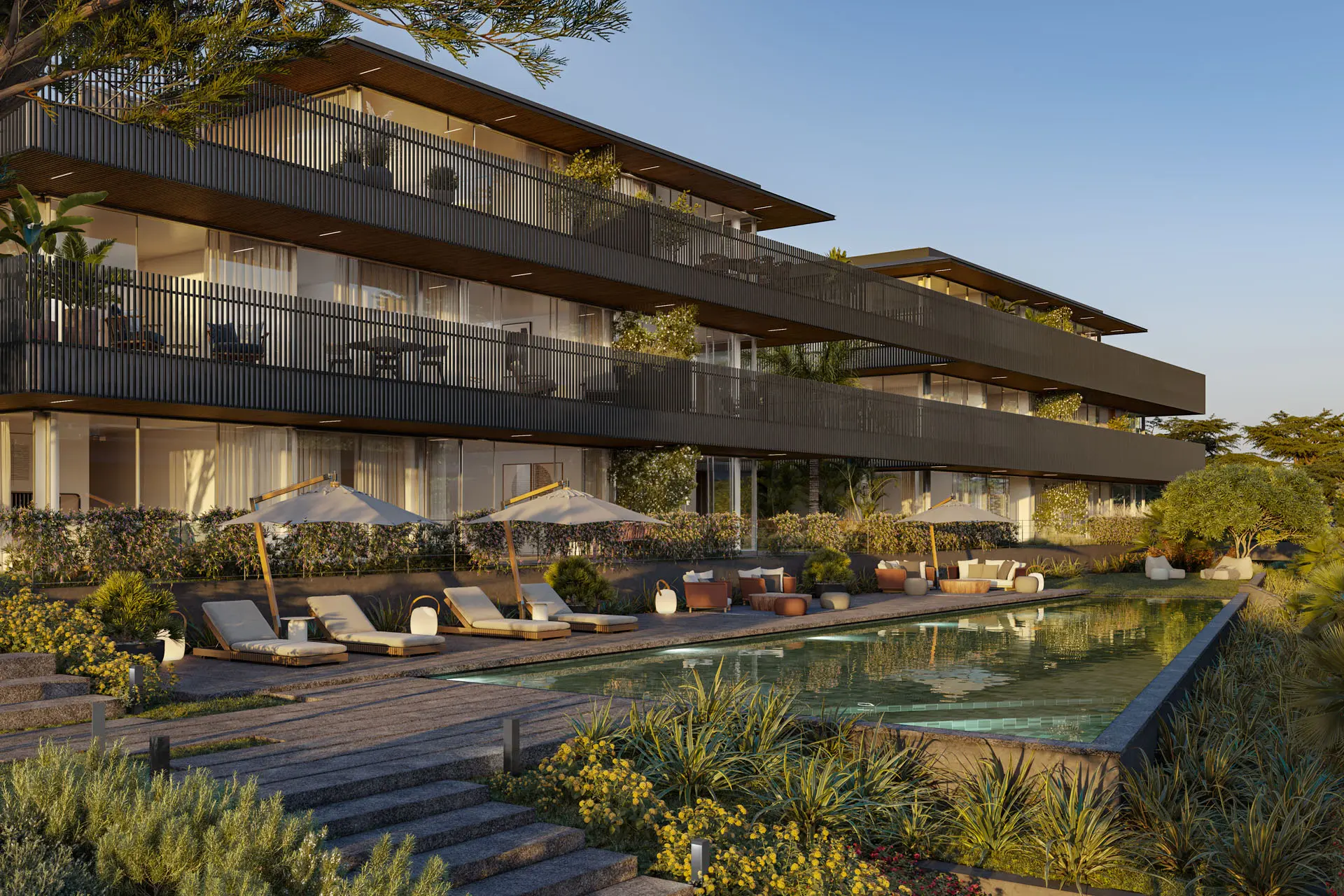 Empreendimento residencial premium com piscina, espreguiçadeiras e zonas de estar